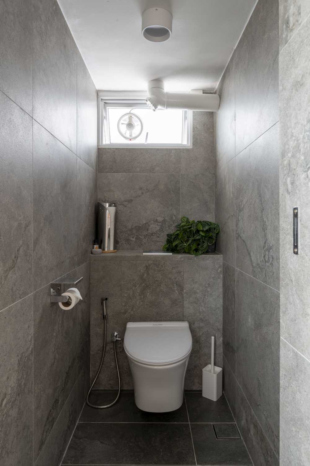 Scandinavian Bathroom with Homogeneous Tiles and Bathroom Stools
