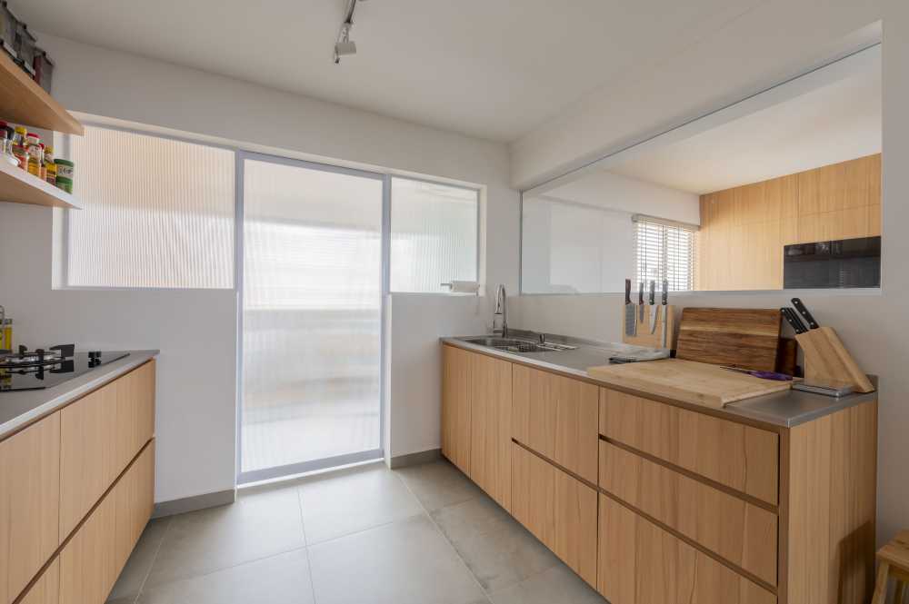 Scandinavian Kitchen with Homogeneous Tiles and Cement Floor