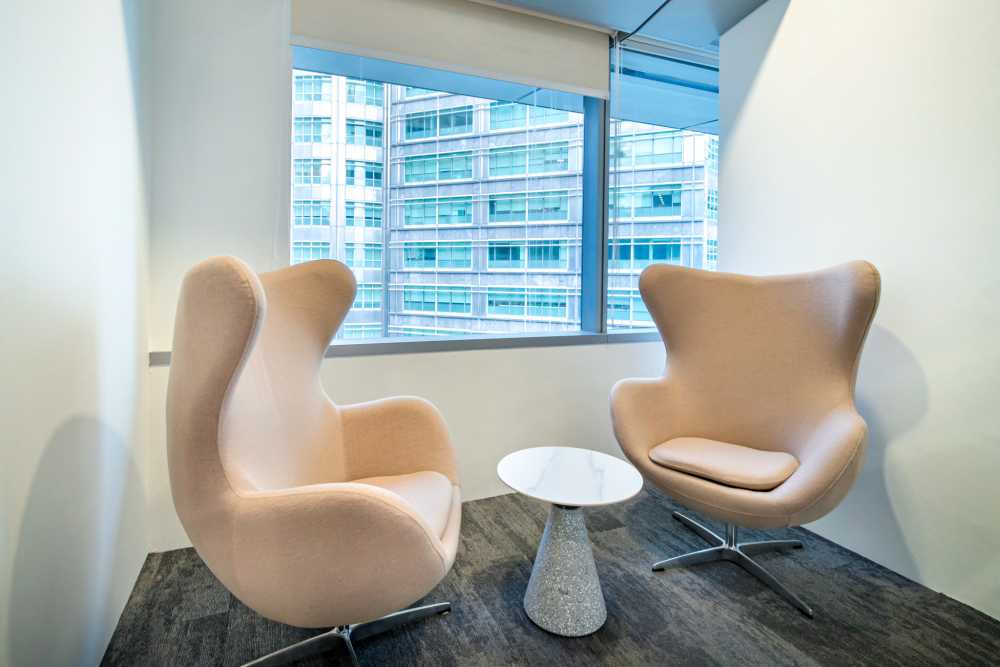 Modern Office with Glass Door and Armchairs