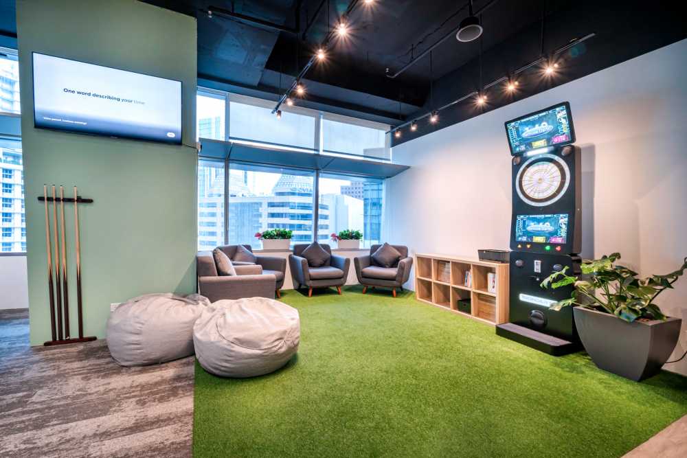 Modern Gaming Room with Bay Window and Carpet