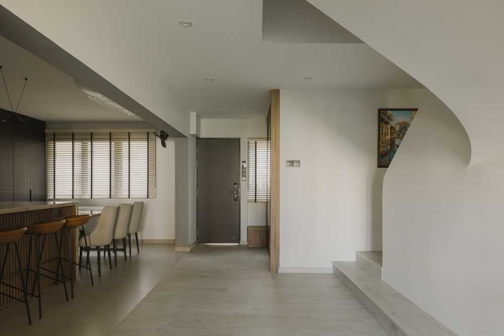 Modern Foyer with Countertop and Staircase