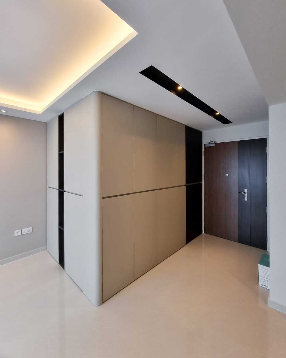 Modern Foyer with Paintings and Storage Cabinets