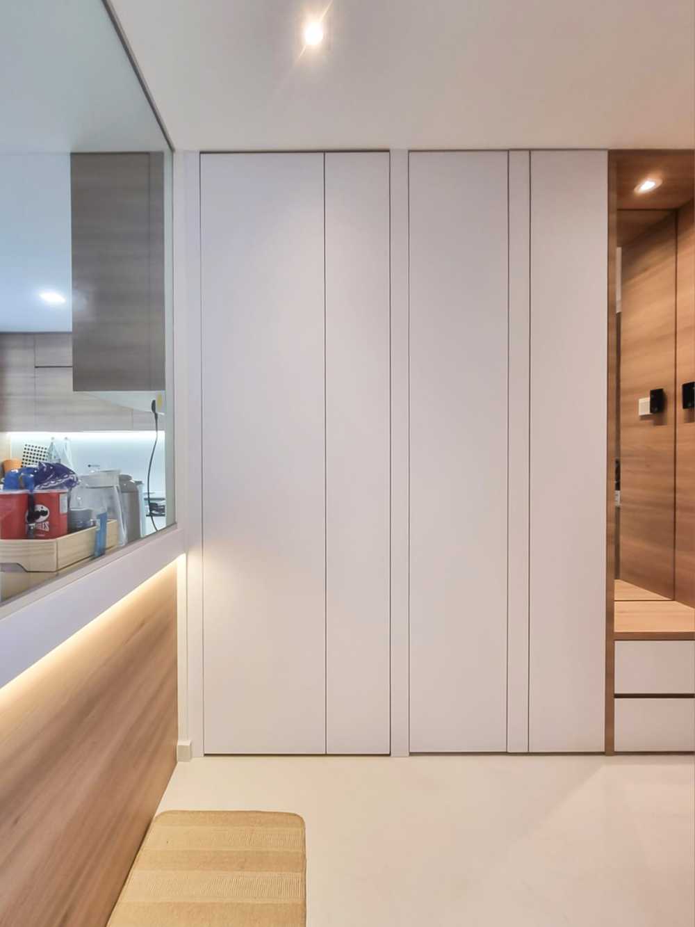 Scandinavian Foyer with Paintings and Storage Cabinets