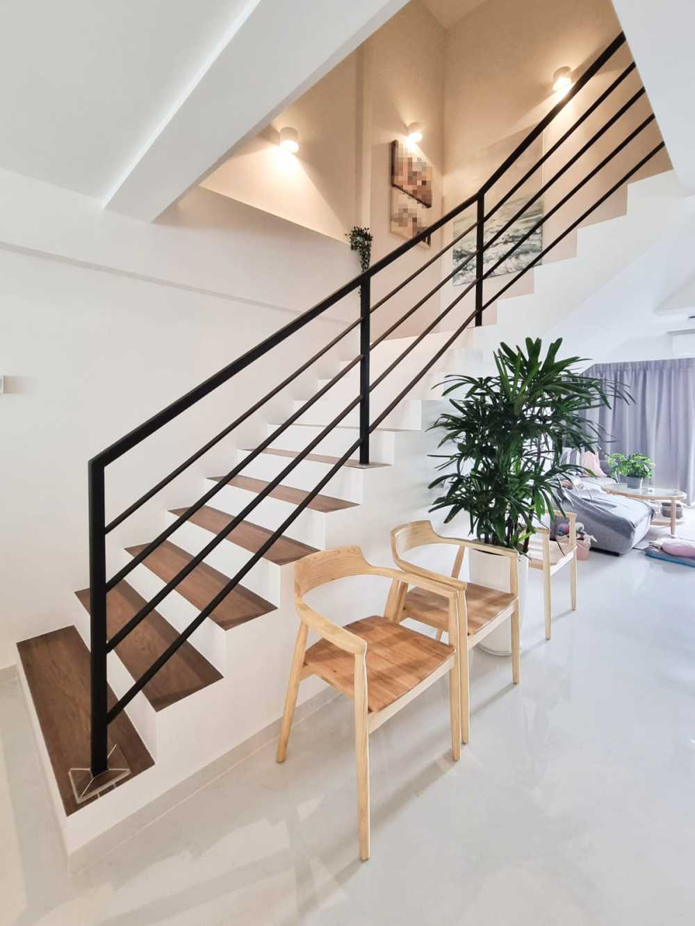Scandinavian Hallway with Staircase and Paintings