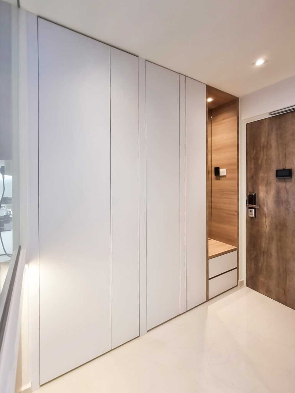 Scandinavian Foyer with Paintings and Storage Cabinets