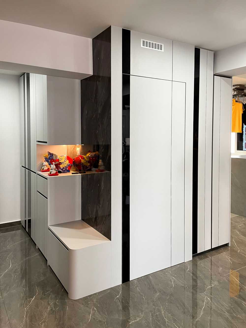 Scandinavian Foyer with Paintings and Storage Cabinets