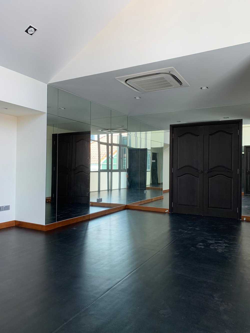 Modern Home Gym with Vinyl Flooring and Mirror
