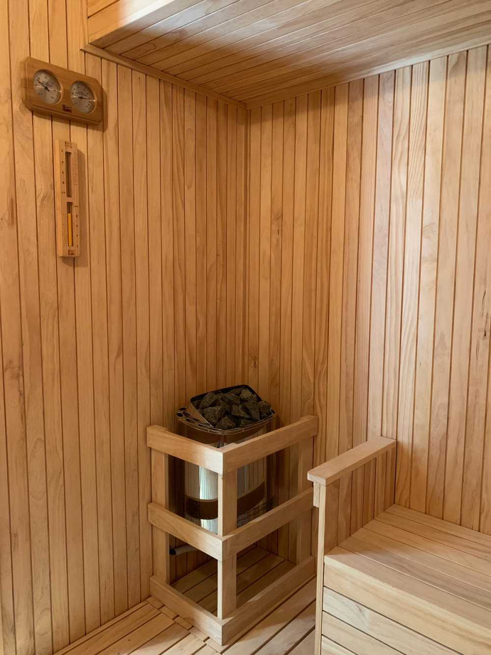 Modern Bathroom with Wood Flooring and Feature Wall