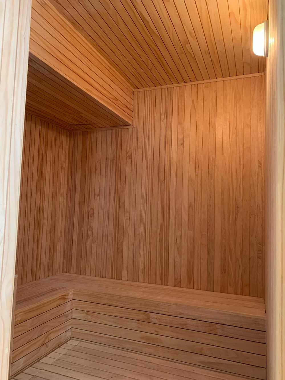 Modern Bathroom with Wood Flooring and Feature Wall