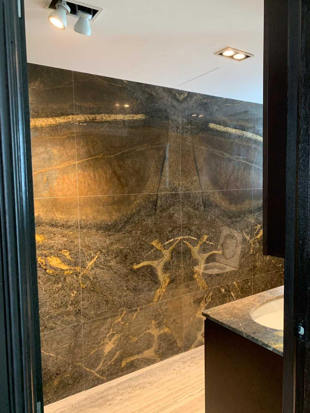 Modern Bathroom with Marble Floor and Feature Wall