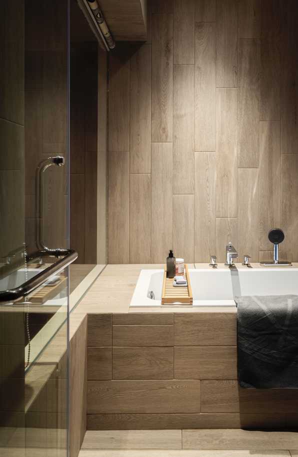Contemporary Bathroom with Feature Wall and Glass Door