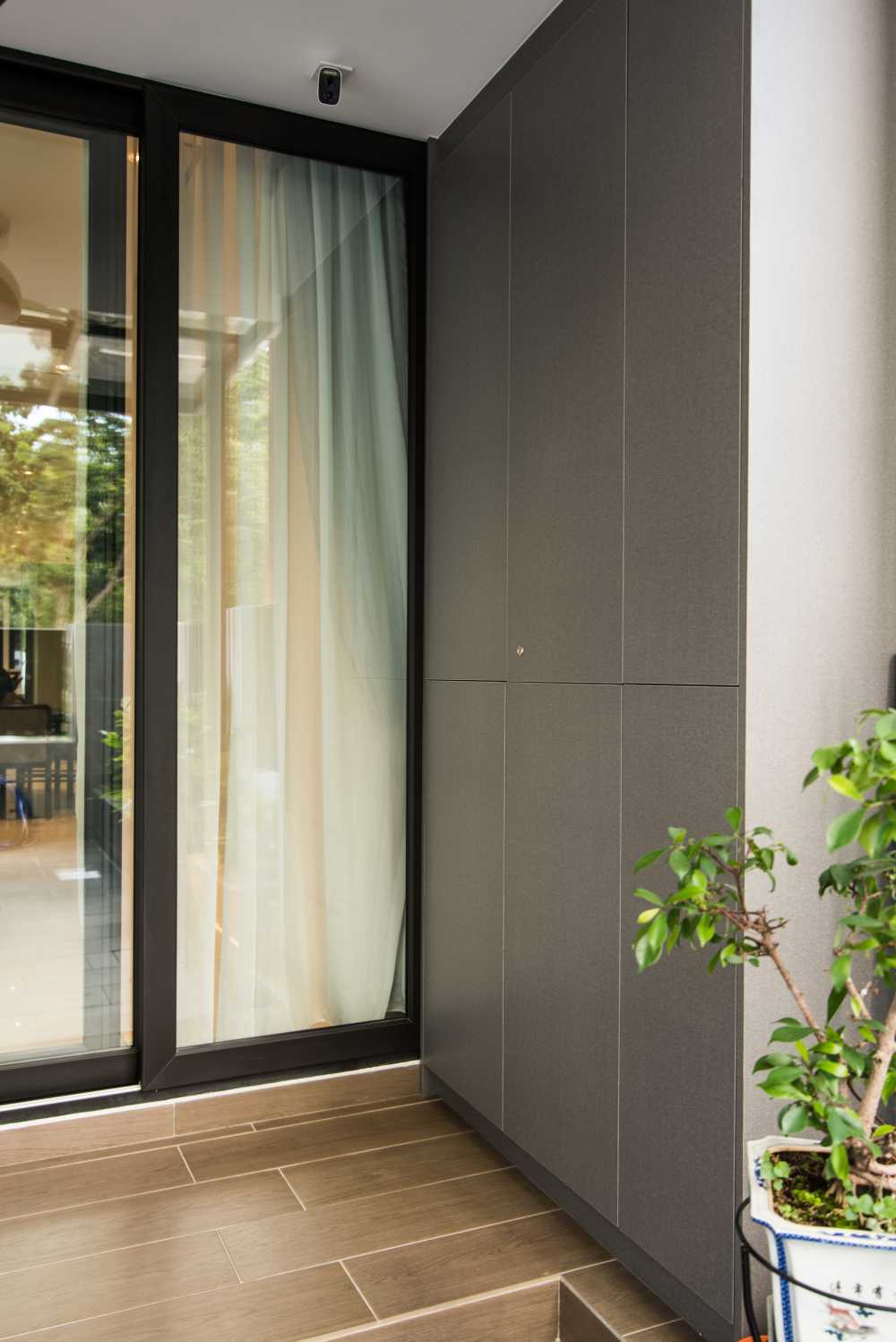 Contemporary Foyer with Wood Flooring and Storage Cabinets