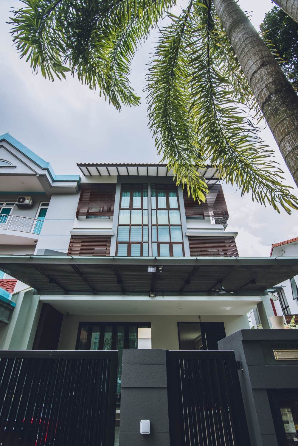 Contemporary Porch with Awning and Metal Gate