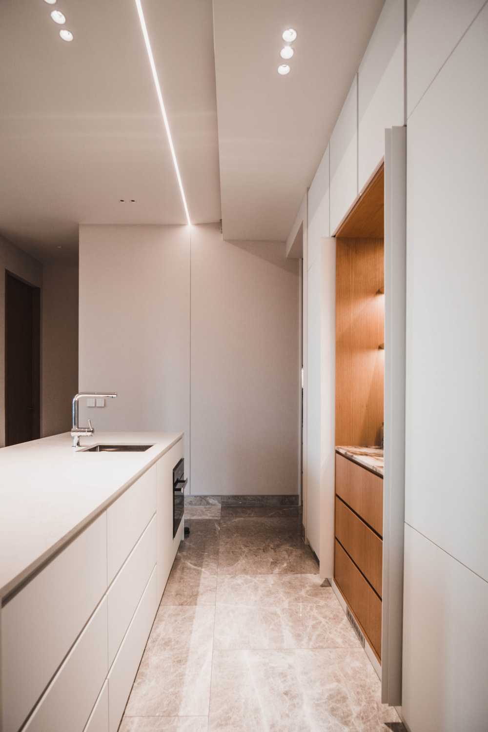 Minimalist Pantry with Marble Floor and Kitchen Island
