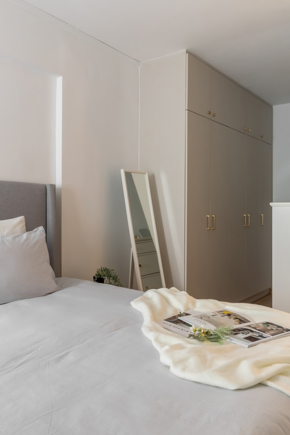 Contemporary Bedroom with Vinyl Flooring and Mirror