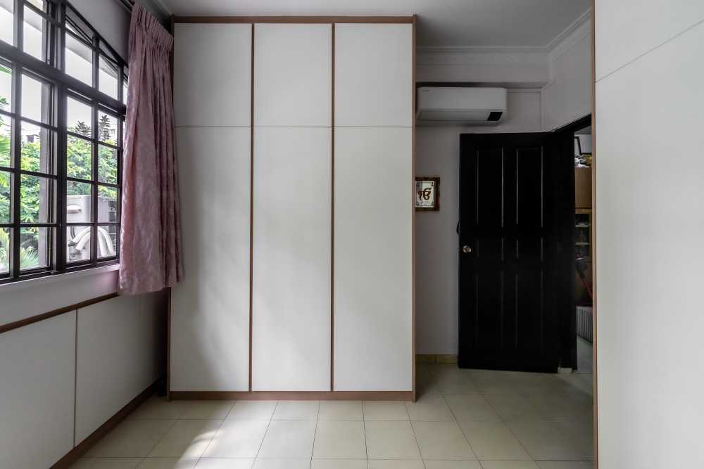 Modern Bedroom with Homogeneous Tiles and Wardrobe