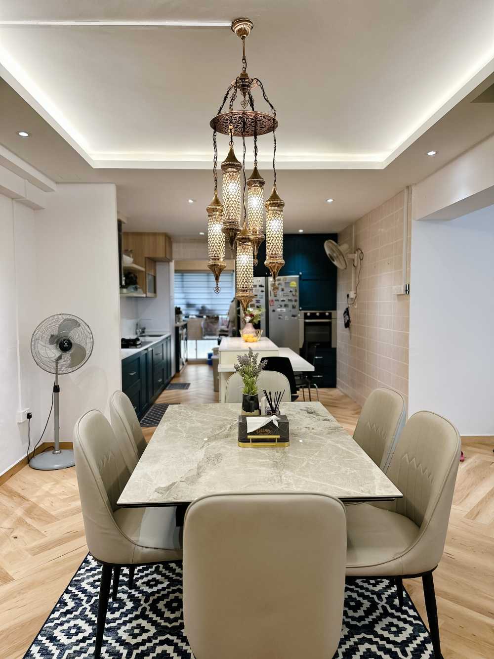 Modern Dining Room with Cove Lighting and Chandelier