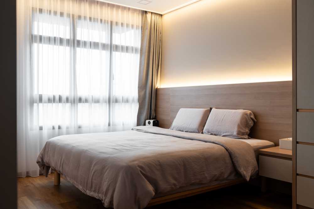 Industrial Bedroom with Homogeneous Tiles and Ceiling Light