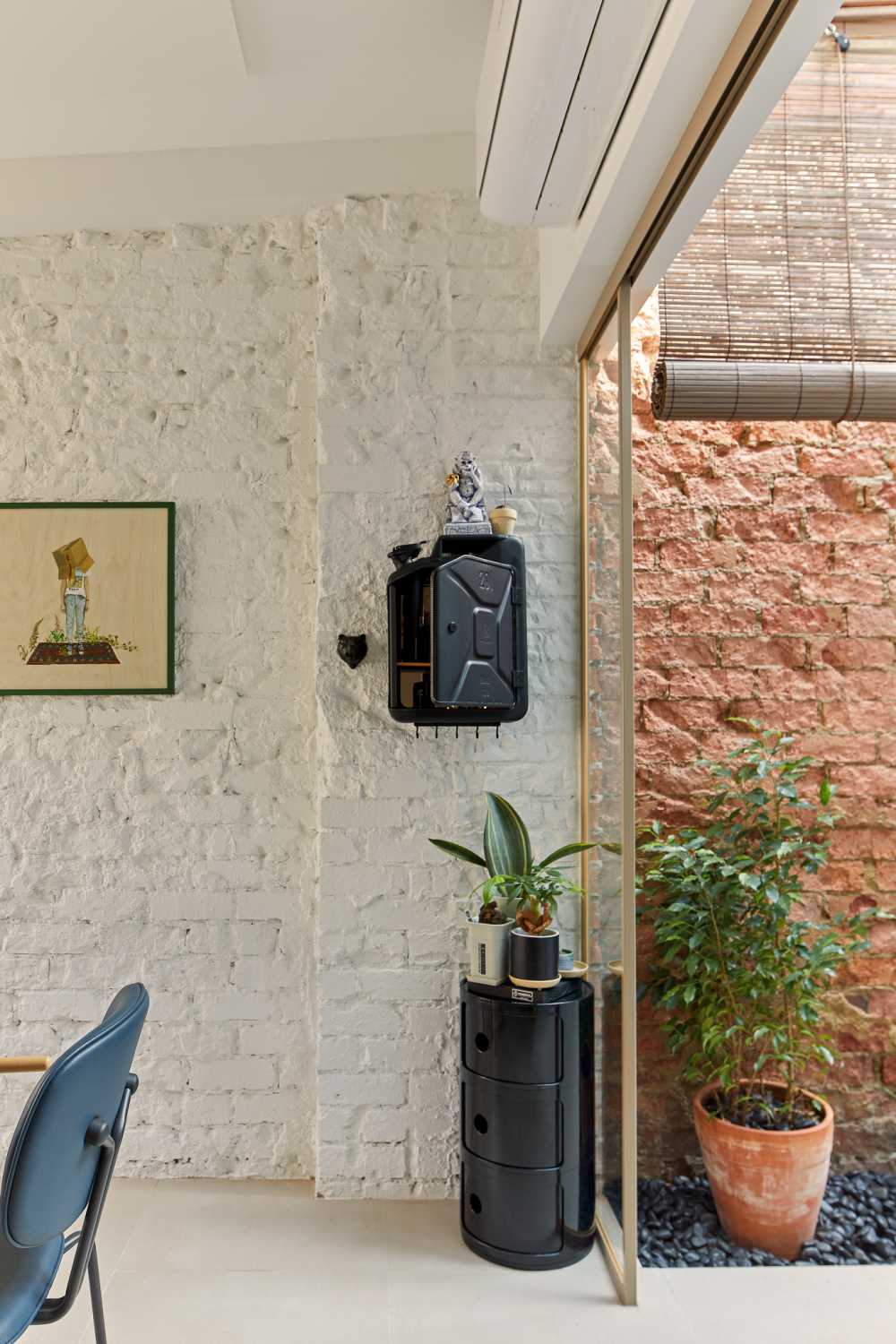 Eclectic Dining Room with Feature Wall and Paintings