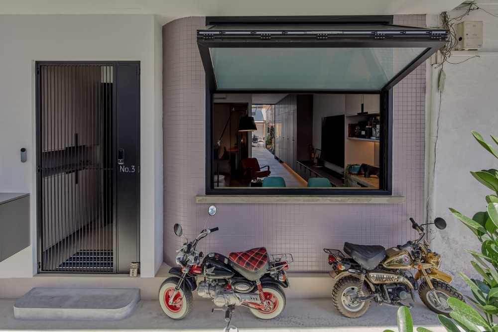 Eclectic Entryway with Shoe Cabinets and Coat Rack