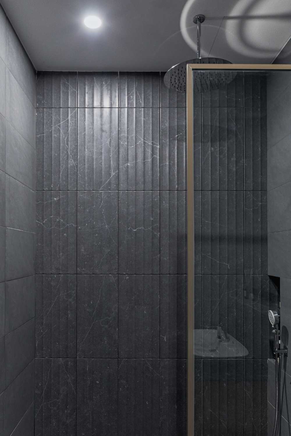 Eclectic Bathroom with Rainshower and Showers