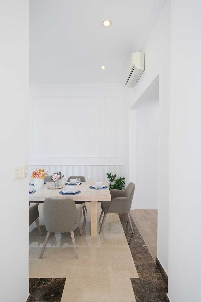Contemporary Dining Room with Feature Wall and Downlights