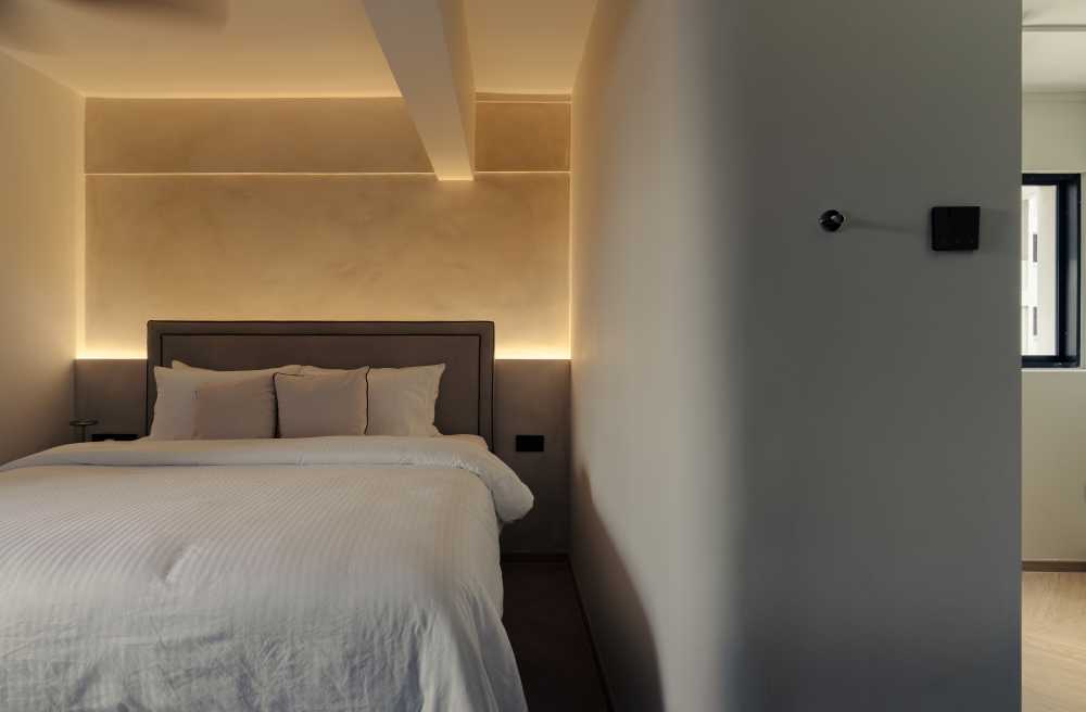 Modern Bedroom with Cove Lighting and Flooring