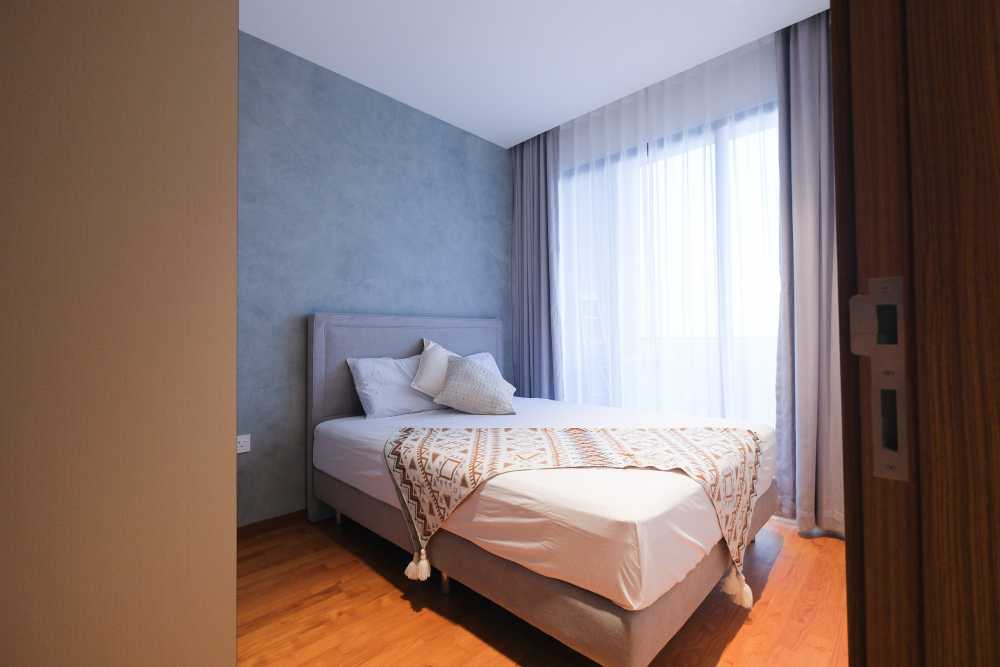 Modern Bedroom with Wood Flooring and Curtain