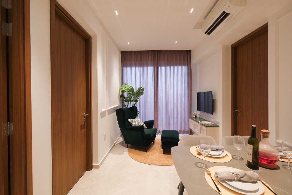 Modern Living Room with TV Console and Armchairs