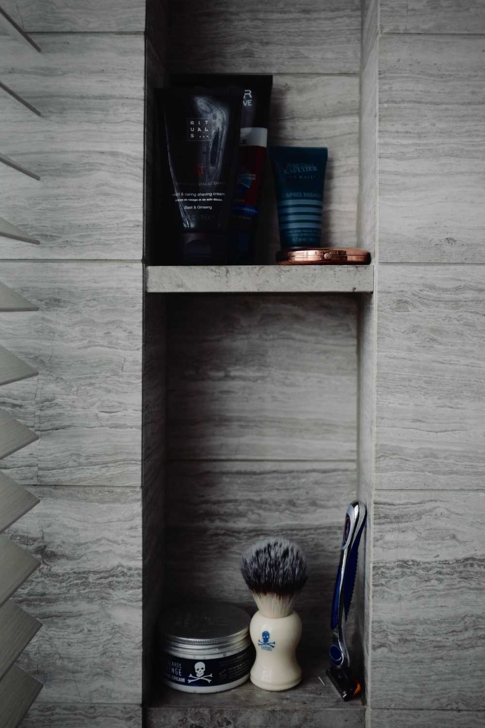 Industrial Bathroom with Homogeneous Tiles and Mirror