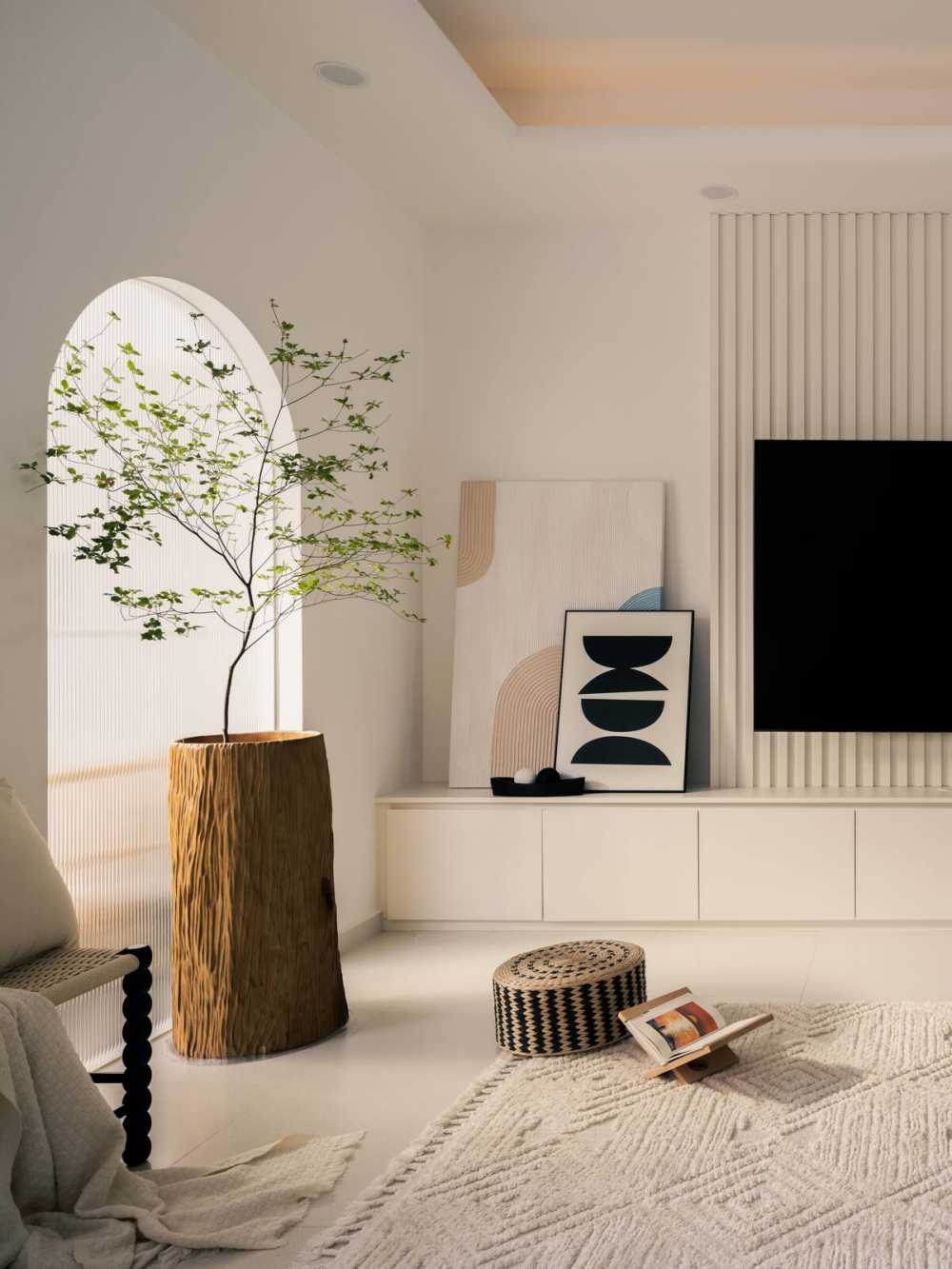 Minimalist Living Room with Homogeneous Tiles and TV Console