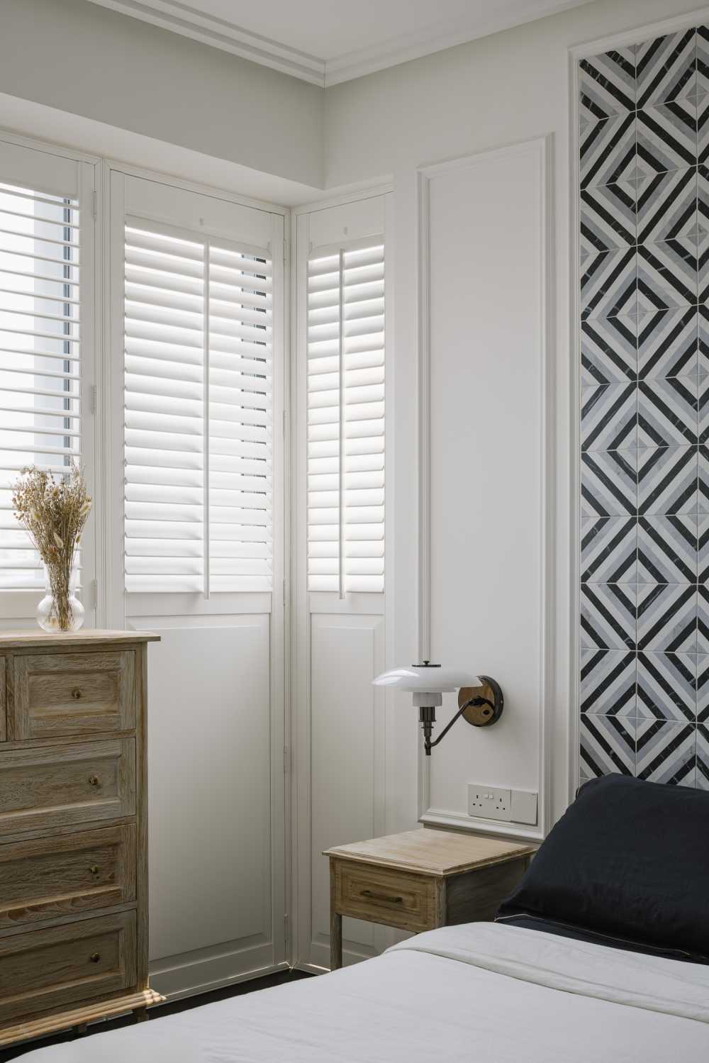 Modern Bedroom with Window Shutters and Bedside Table