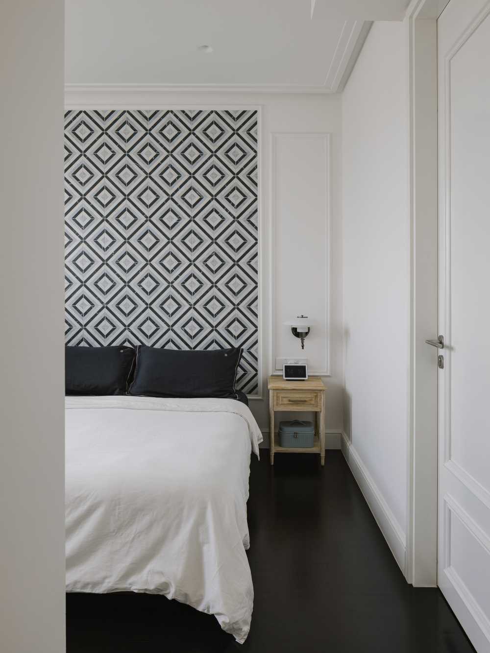 Modern Bedroom with Wood Flooring and Feature Wall