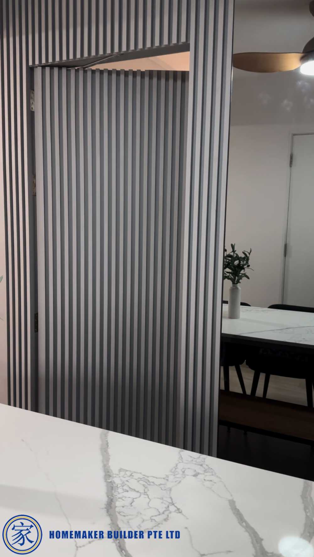 Contemporary Dining Room with Countertop and Feature Wall