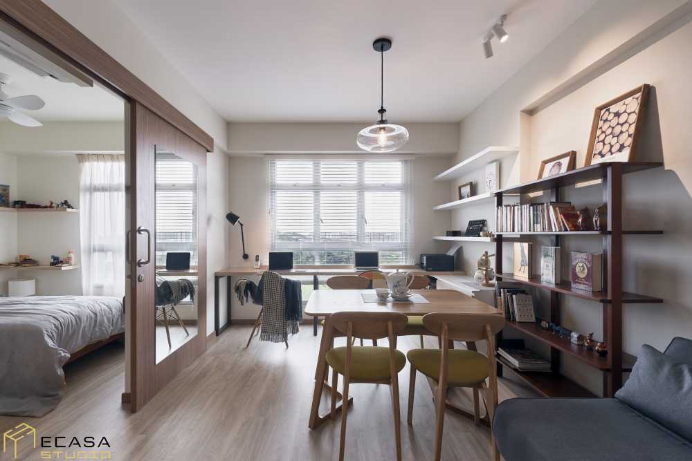 Scandinavian Living Room with Bookshelf and Wood Flooring