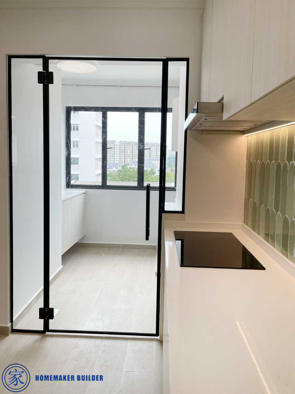 Minimalist Kitchen with Homogeneous Tiles and Glass Door