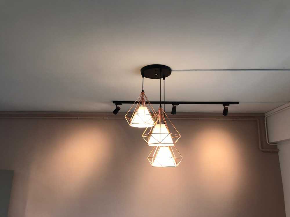 Minimalist Dining Room with Chandelier and Lighting