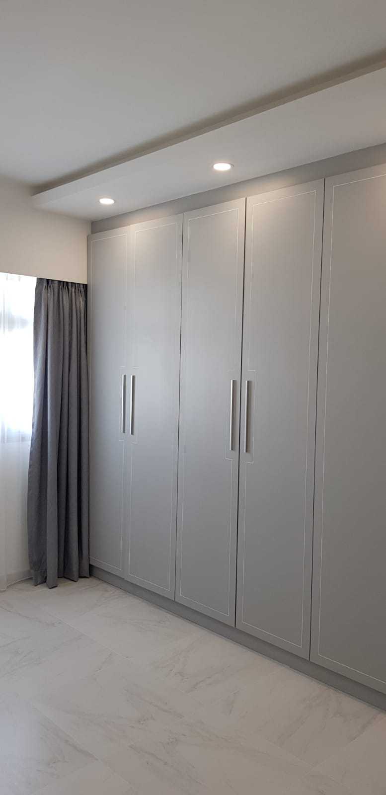 Minimalist Bedroom with Drop Ceiling and Wardrobe