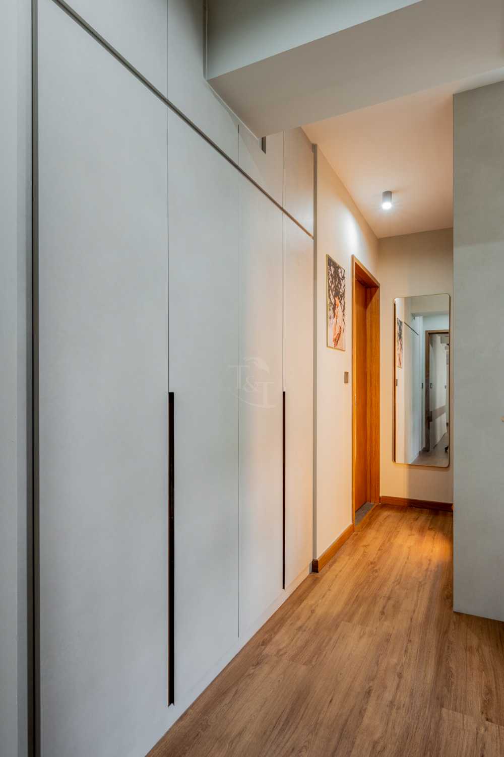Modern Bedroom with Wood Flooring and Ceiling Light