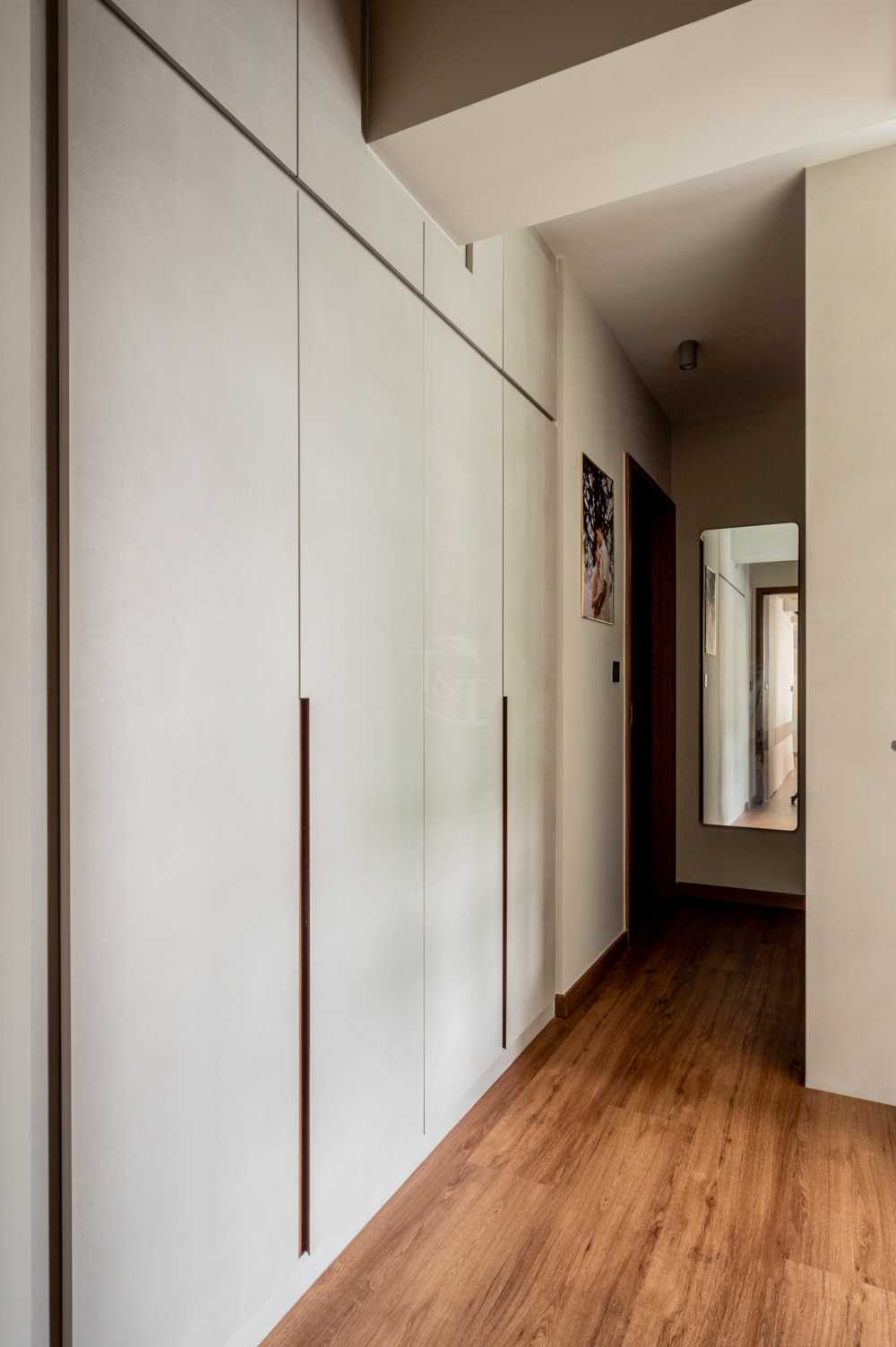 Modern Bedroom with Wood Flooring and Drop Light
