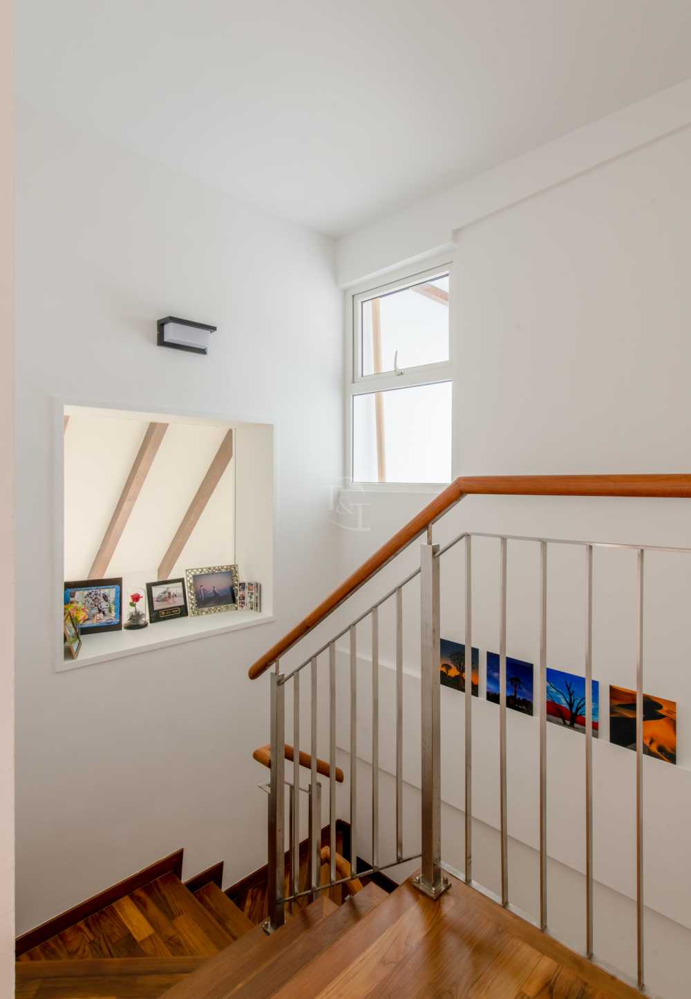 Eclectic Hallway with Wood Flooring and Staircase