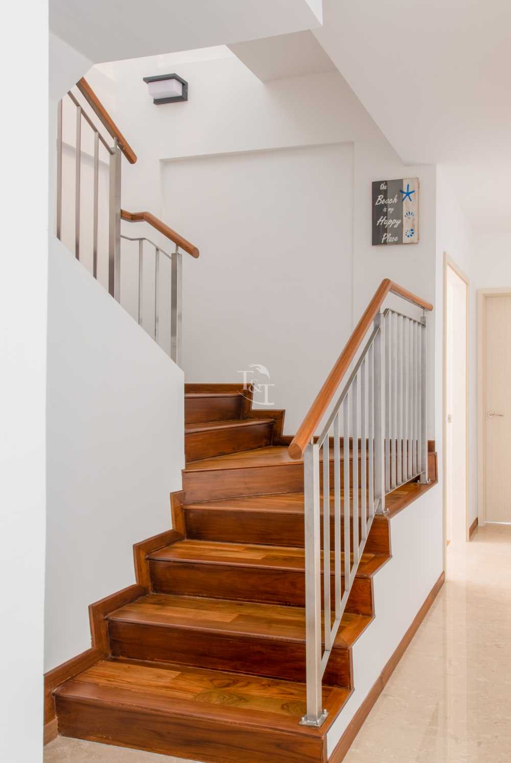 Eclectic Hallway with Wood Flooring and Staircase