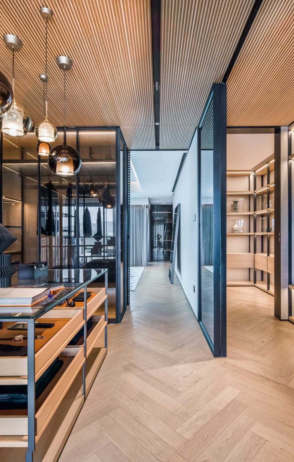 Contemporary Walk-in Wardrobe with Herringbone Tiling and Drop Light