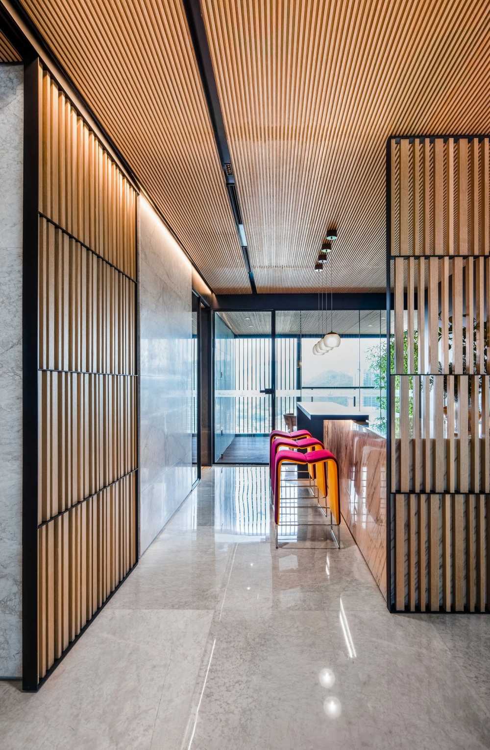 Contemporary Foyer with Marble Floor and Feature Wall