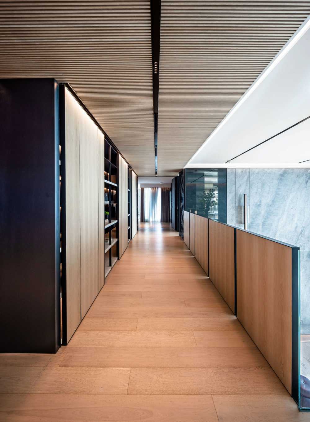 Contemporary Foyer with Wood Flooring and Feature Wall