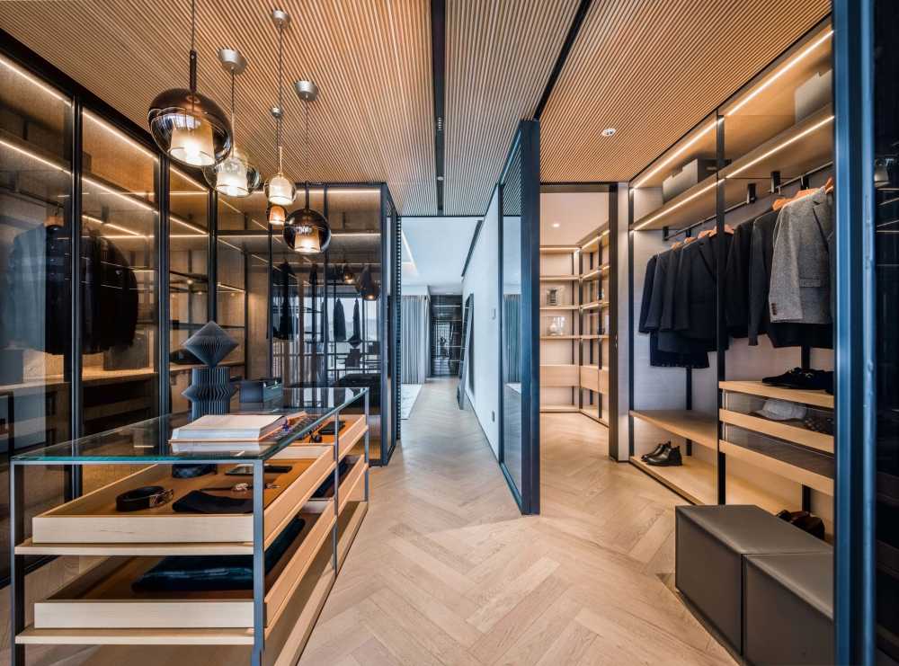 Contemporary Walk-in Wardrobe with Herringbone Tiling and Mirror