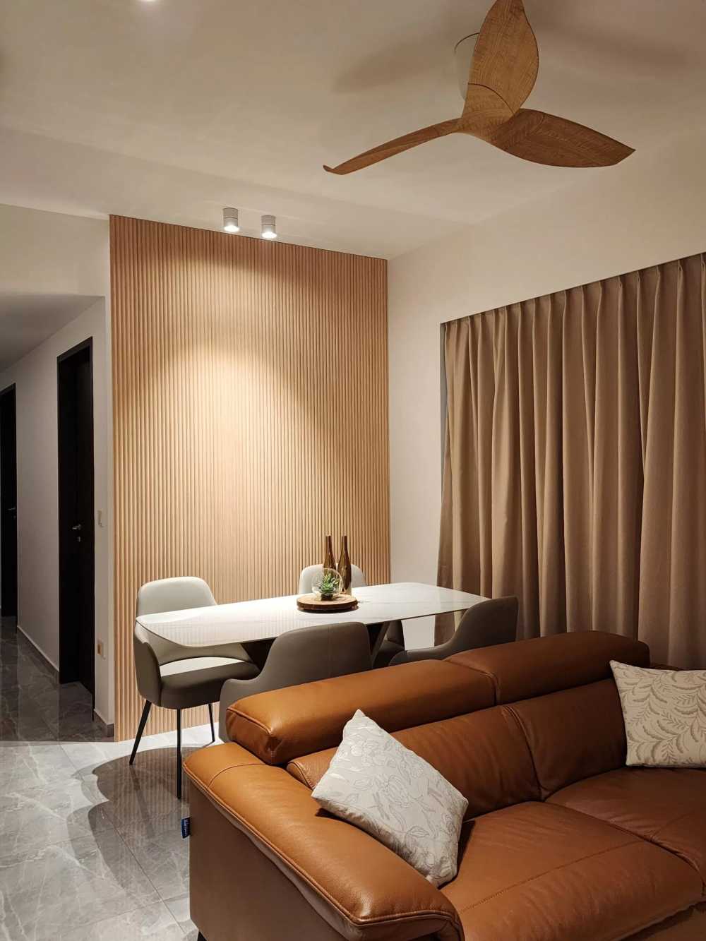 Contemporary Dining Room with Homogeneous Tiles and Feature Wall