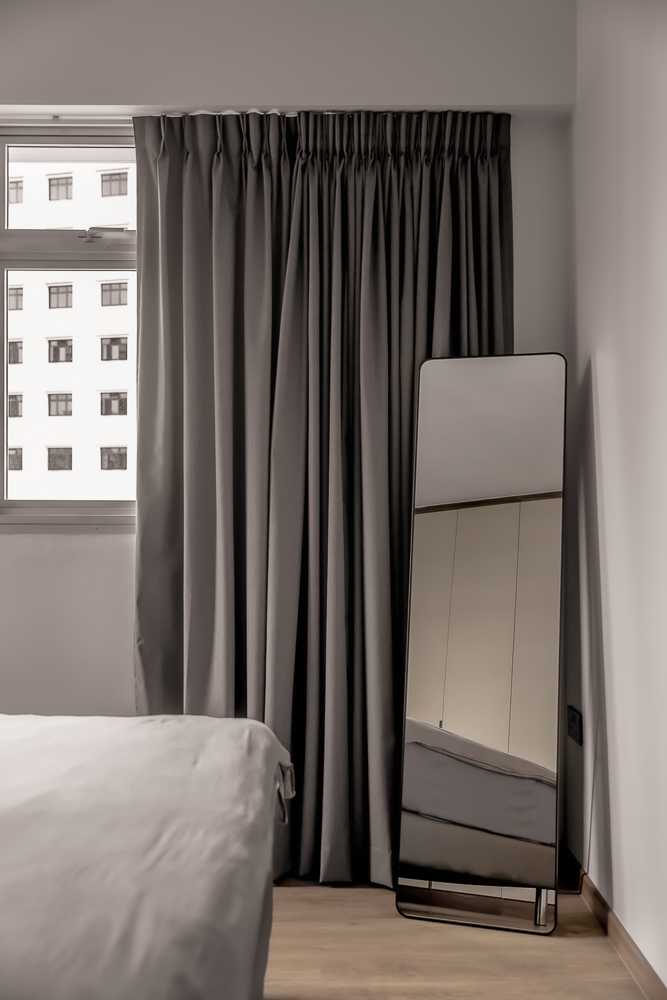 Contemporary Bedroom with Vinyl Flooring and Mirror