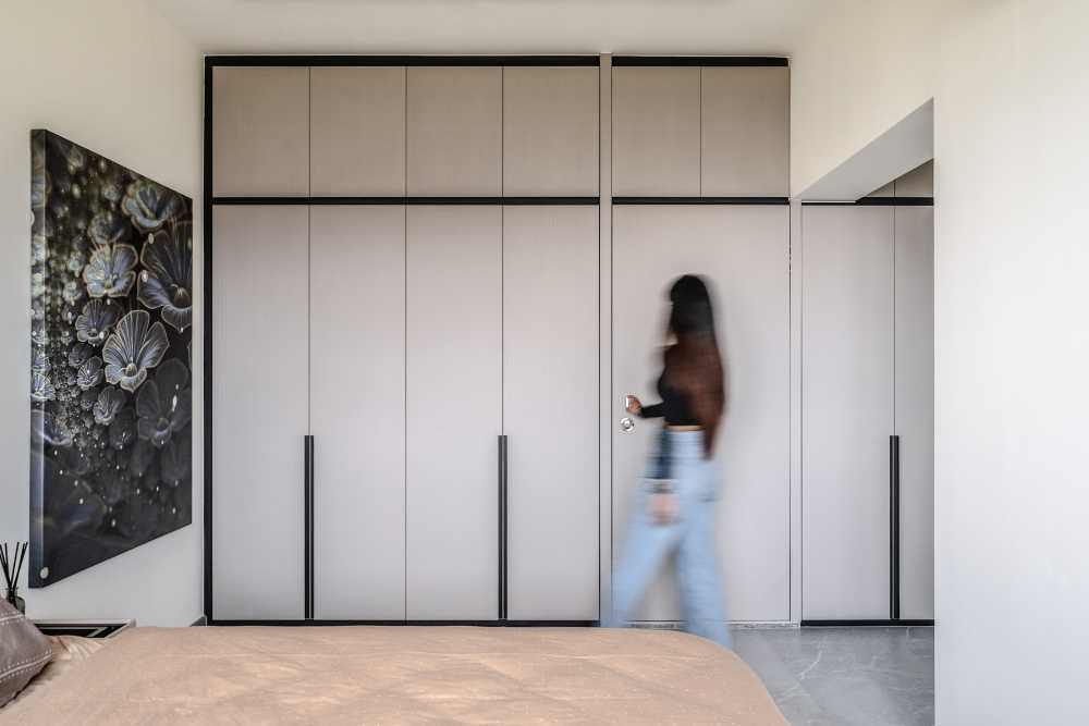 Contemporary Bedroom with Homogeneous Tiles and Wardrobe