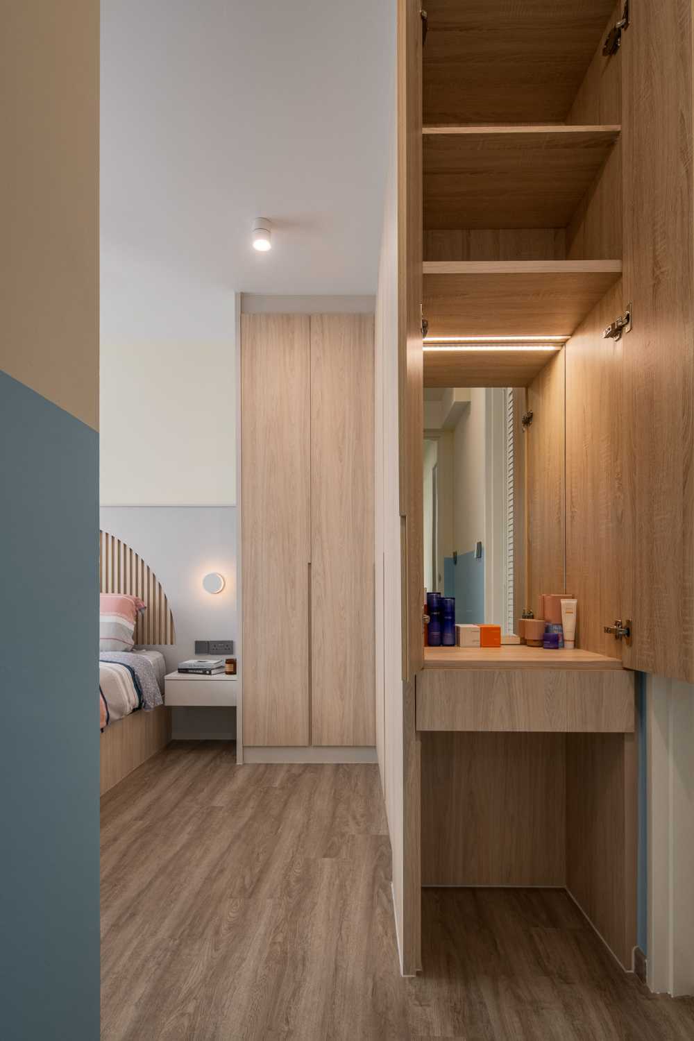 Scandinavian Bedroom with Wood Flooring and Built-in Bed